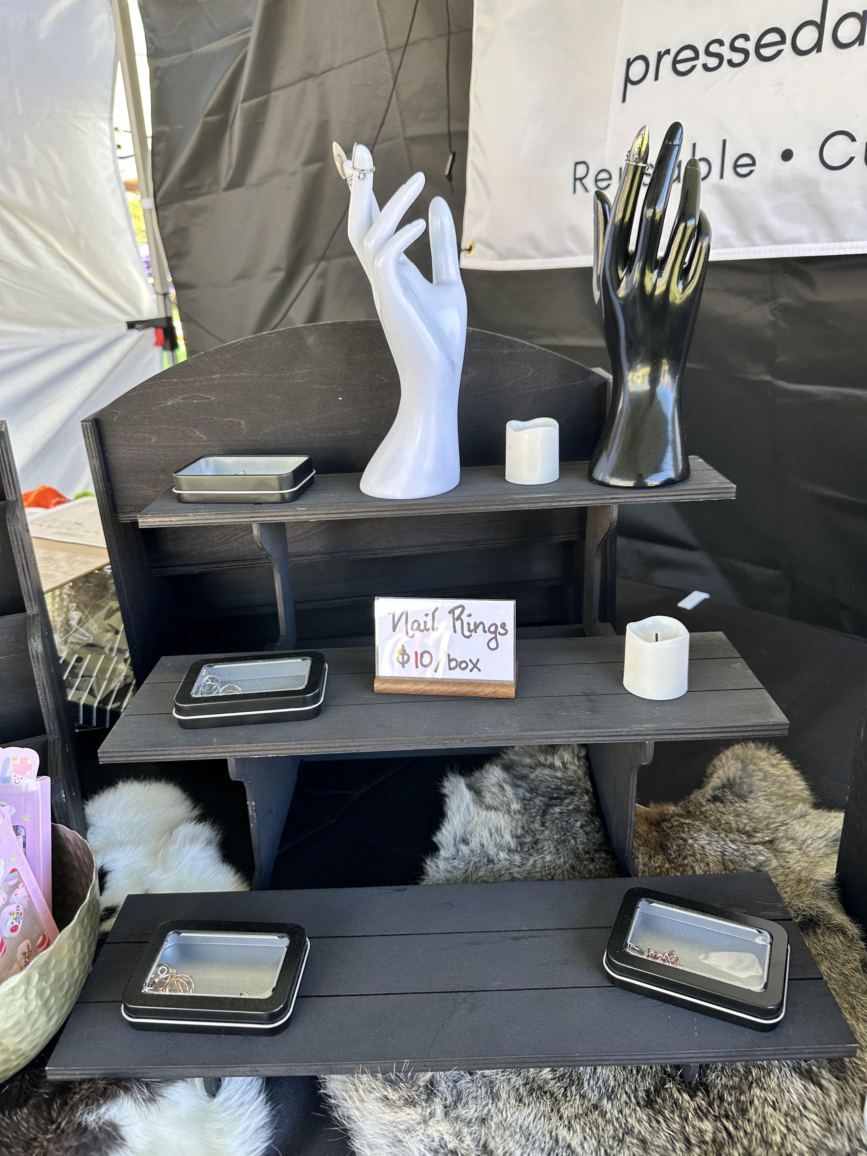Display shelves and nail fitting station