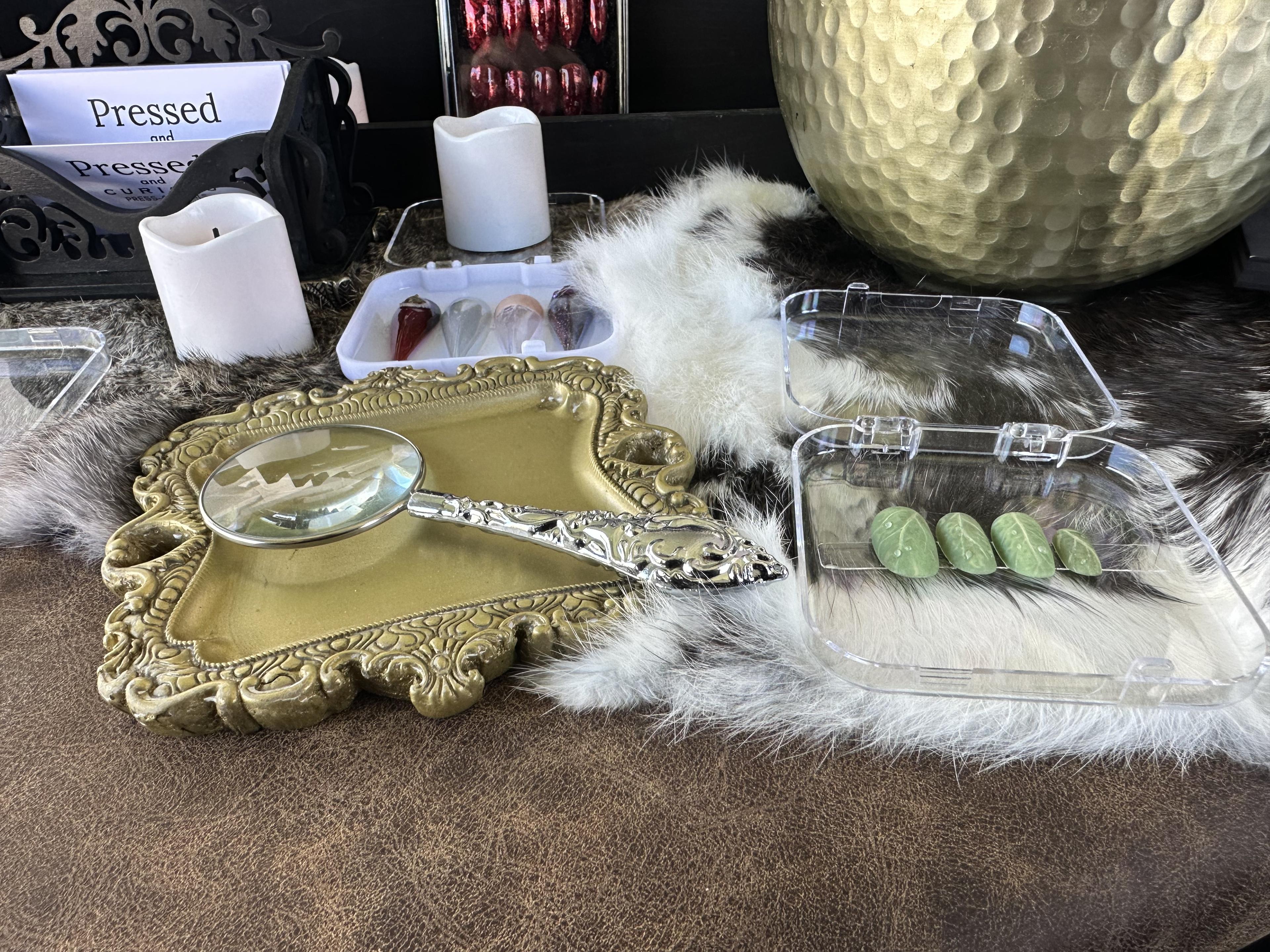 Booth display with vintage trays and fur accents